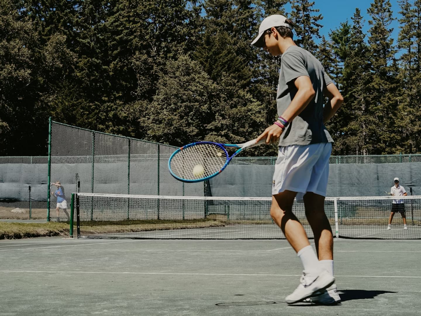 Friends playing on the tennis court